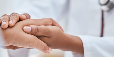 Help, healthcare or doctor holding hands with patient zoom for support, trust or communication for cancer result. Medical, medicine or insurance consulting for health, wellness or heart problem news