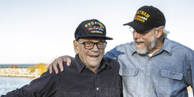 Two Generations Of Playful USA Military Veterans Telling Jokes